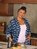 Adorable mom wets her singlet and makes it almost see-though. Can you see her nipple?