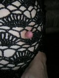 Mature hottie models a knit outfit that doesnt conceal her big boobs and booty