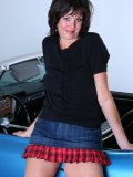 Hot smoking MILF hops into a cool-ass blue convertible and gets all naked there