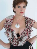 Mature beauty with a nice-sized rack bares her pussy and shows her clit up close