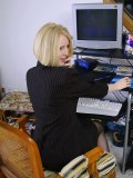 Office girl gets bored with typing. She strips and shows her beautiful body in the tight bodysuit!