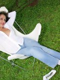 Beautiful mature milf posing in her sexy white stockings in her garden