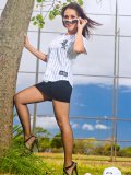 Sexy MILF in baseball uniform and black pantyhose getting stripped on the court