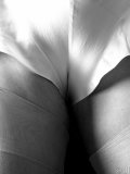 Busty MILF gets rid of her vintage outfit nice and slow on black-and-white pics