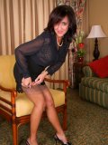 Slutty mature housewife playing with her dildo while showing off her delicious ass in nylons