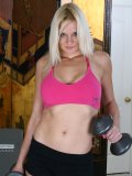 Gym mom works with really heavy barbells while demonstrating even heavier boobs