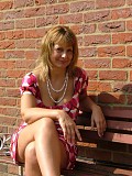 Hot pictures of a gorgeous blonde milf teasing by lifting her dress up to flash her white panties