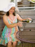 Holiday mom sipping champagne on the terrace and showing off her hairy beaver