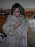 Mature lady with oversized boobs enjoys the tickle of soft fur in her bathroom