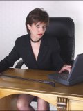 This busty MILF is too horny to work, so she ends up jilling off under her table
