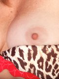 Sexy mature lady arouses herself with her silky night dress on the bed! Want to have a look?