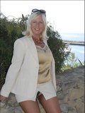 Crazy blonde milf Sandy doesn't mind showing her massive tits in public