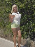 Horny busty mature babe loves to show off her huge tits posing in the car