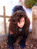 Mature brunette with a sexy body poses for some sexy Halloween pictures