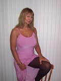 Seductive mature blonde takes her bra off to squeeze and tease her gigantic boobs